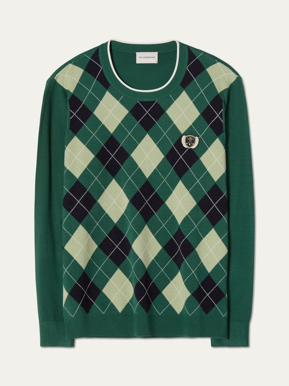 The Fairway Sweater Men by We Norwegians features a light and dark green argyle knit front, a chest crest patch, and white neckline trim. Lightweight and breathable, it combines comfort with timeless style.
