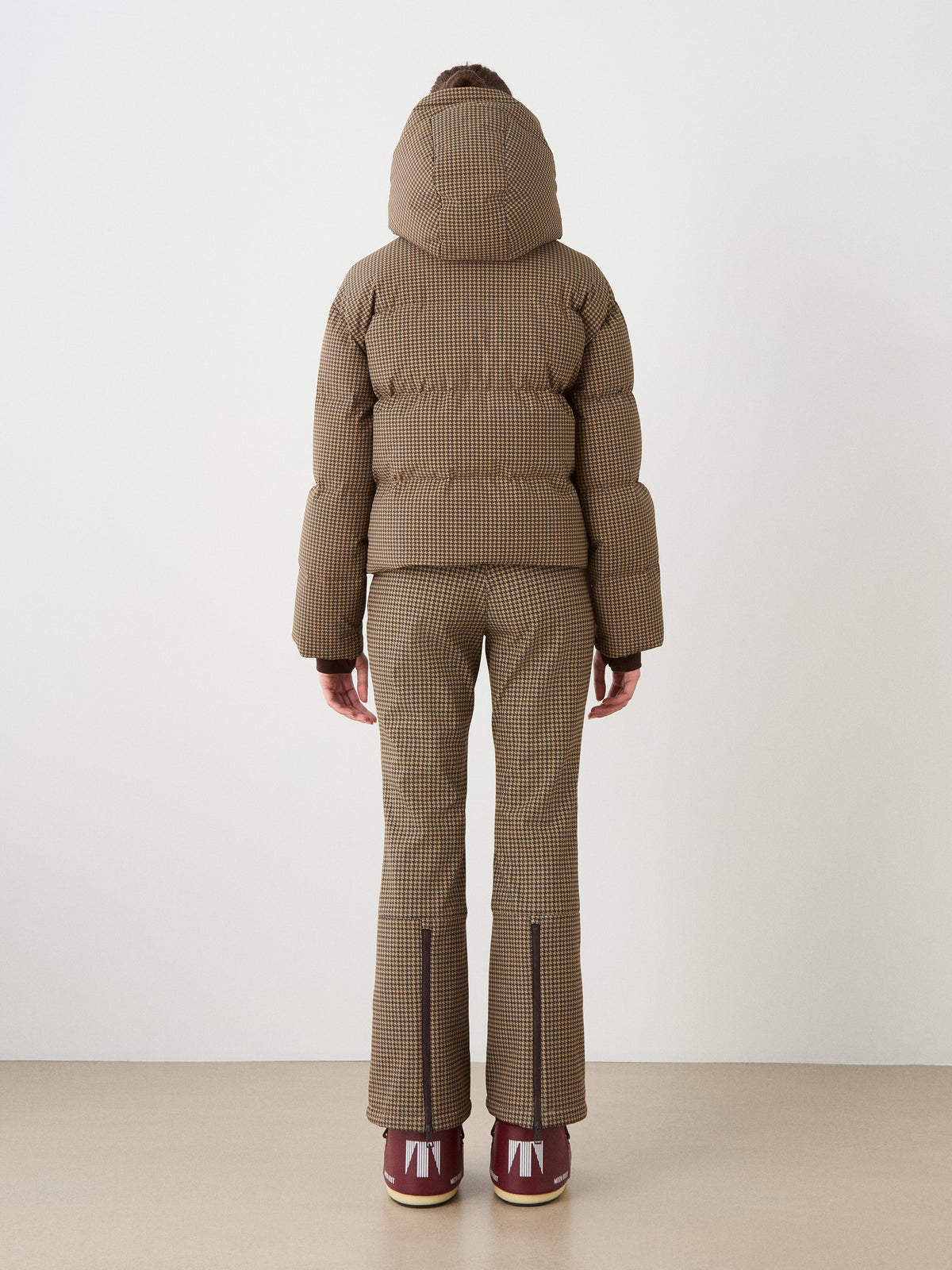 A person wearing the We Norwegians Glenshee Ski Jacket Women stands with their back to the camera against a plain white background.