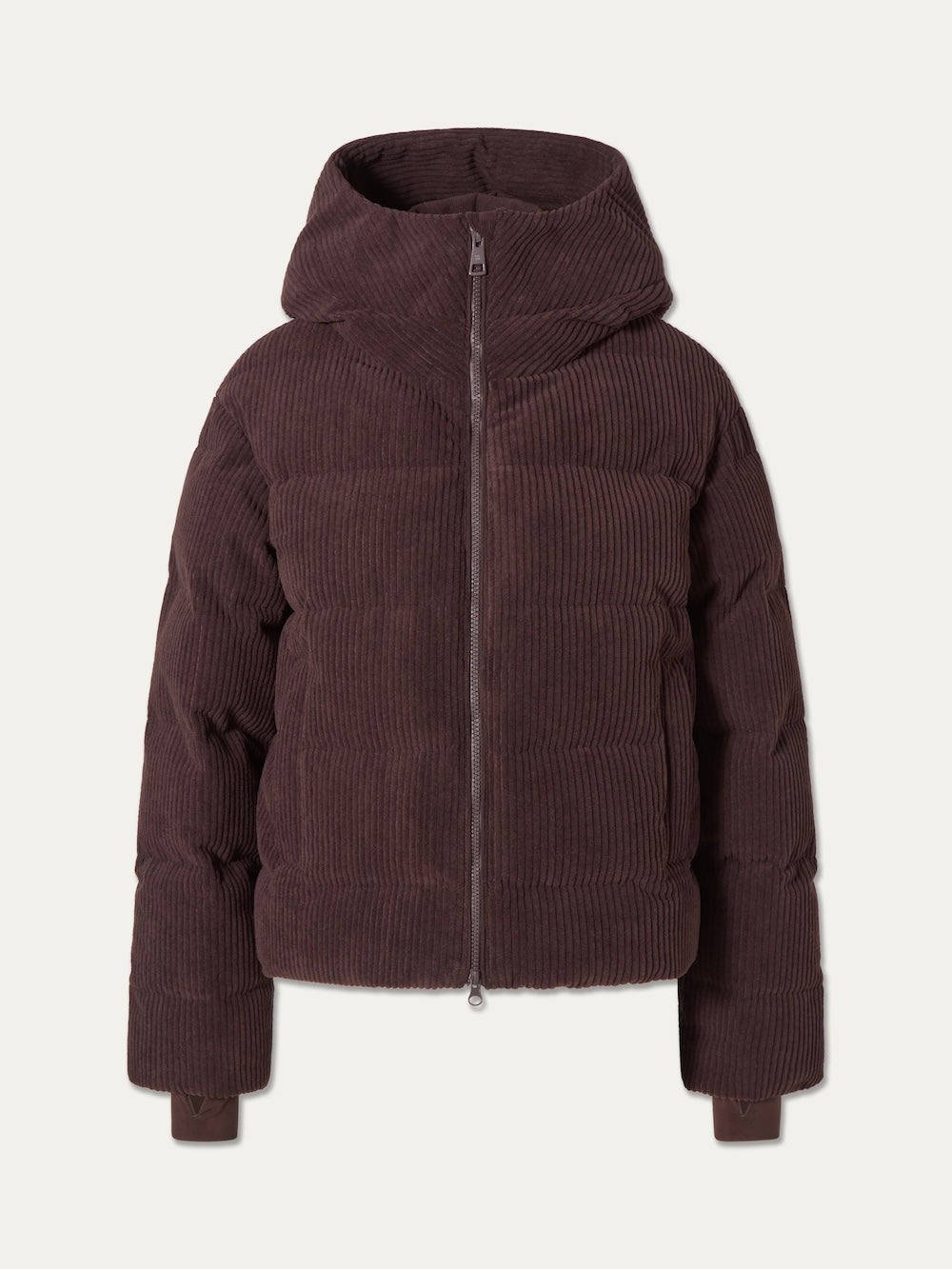 The Britt Ski Jacket Women by We Norwegians is a brown corduroy ski jacket with a hood and front zipper, shown on a plain light background—a stylish, sustainable ski wear choice.