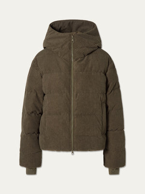 The Britt Ski Jacket Women by We Norwegians is an olive-green corduroy ski jacket with a front zipper, hood, and long sleeves—sustainably stylish and shown on a plain white background.