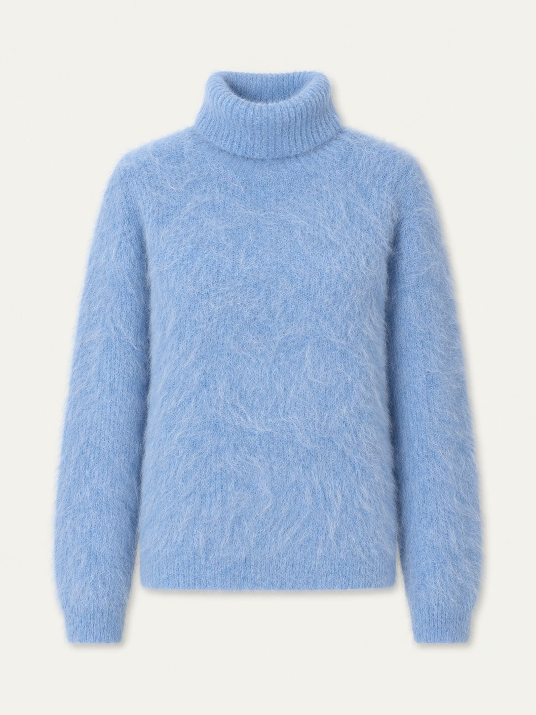A cozy, light blue Myrull Sweater Women by We Norwegians is displayed on a plain white background. This long-sleeve, fuzzy alpaca sweater features a relaxed fit with soft, textured fabric and ribbed cuffs, hem, and collar—perfect as an insulating ski mid-layer for cold days.