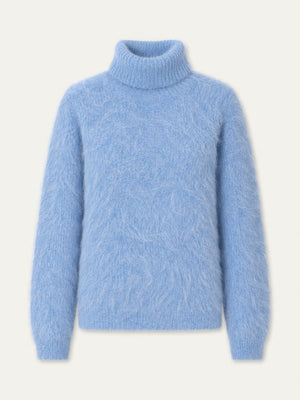 A cozy, light blue Myrull Sweater Women by We Norwegians is displayed on a plain white background. This long-sleeve, fuzzy alpaca sweater features a relaxed fit with soft, textured fabric and ribbed cuffs, hem, and collar—perfect as an insulating ski mid-layer for cold days.