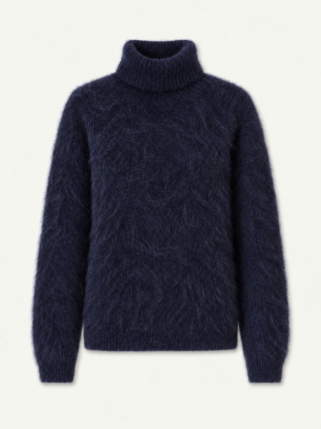 The We Norwegians Myrull Sweater Women—featuring a fuzzy navy blue turtleneck design with long sleeves, ribbed cuffs, and a ribbed hem—is showcased on a plain light background, making it an ideal cozy mid-layer for ski outings.