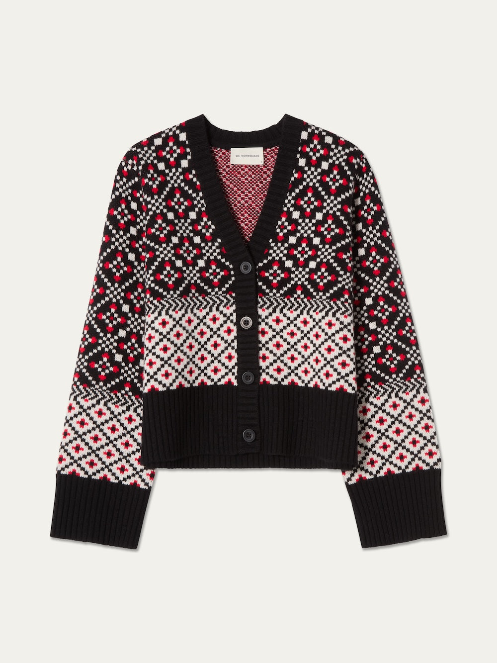 The We Norwegians Telemark Cardigan Women is a black, red, and white merino wool cardigan featuring a Nordic knitwear-inspired geometric pattern reminiscent of the classic Telemark Cardigan. It has a button front, V-neckline, long sleeves, and ribbed cuffs and hem.