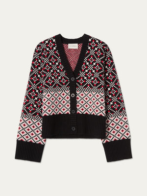 The We Norwegians Telemark Cardigan Women is a black, red, and white merino wool cardigan featuring a Nordic knitwear-inspired geometric pattern reminiscent of the classic Telemark Cardigan. It has a button front, V-neckline, long sleeves, and ribbed cuffs and hem.