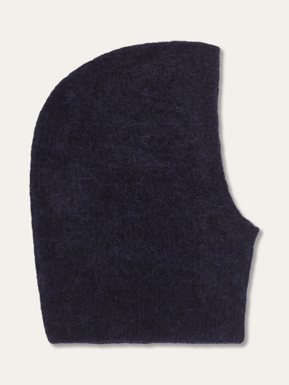 The We Norwegians Myrull Balaclava in dark navy blue is shown flat, featuring a fuzzy knit, rounded top, and curved face opening.