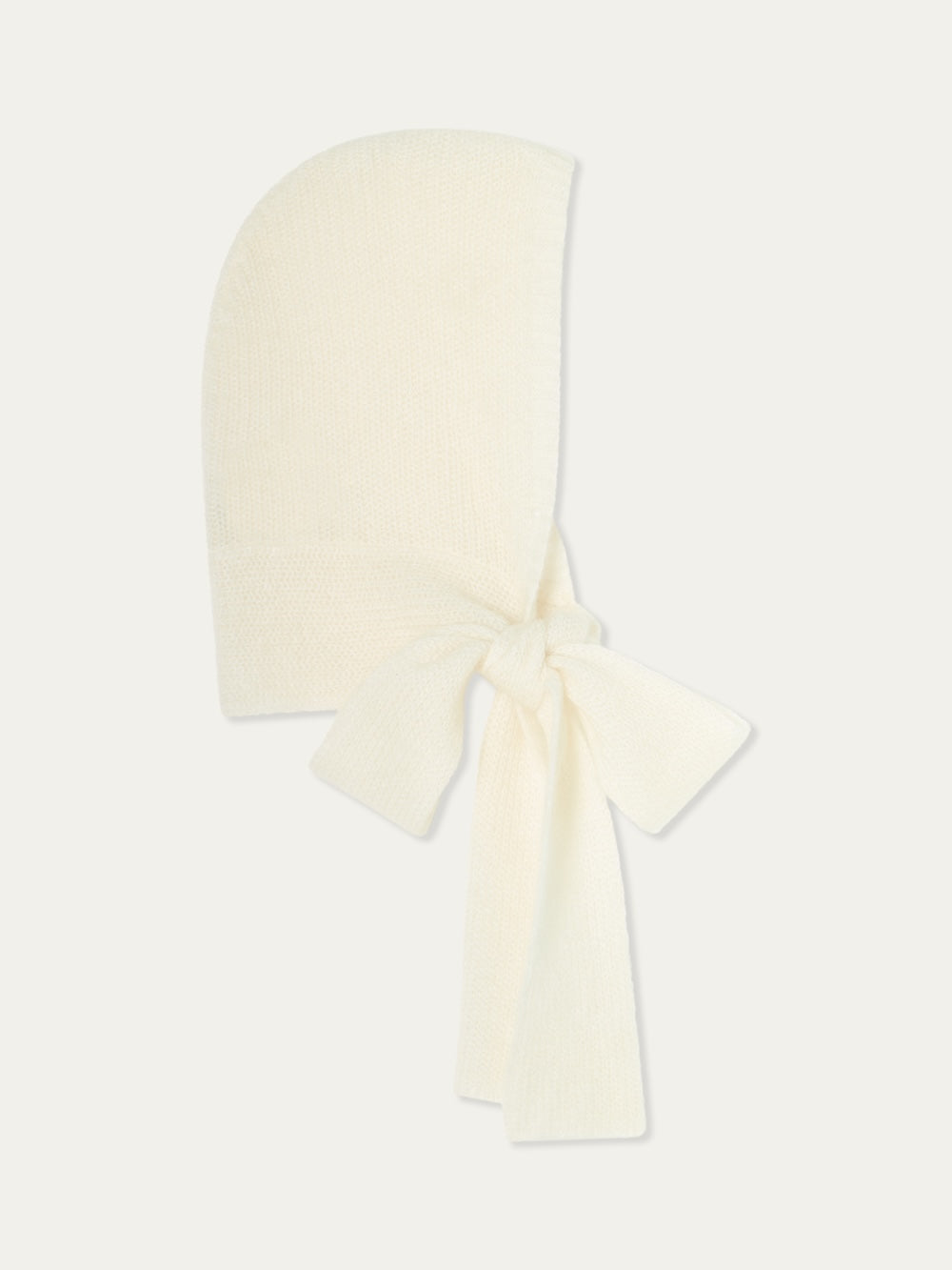 Cream-colored Pudder Balaclava by We Norwegians, a mohair headpiece with a tie closure under the chin for cosy winter wear.
