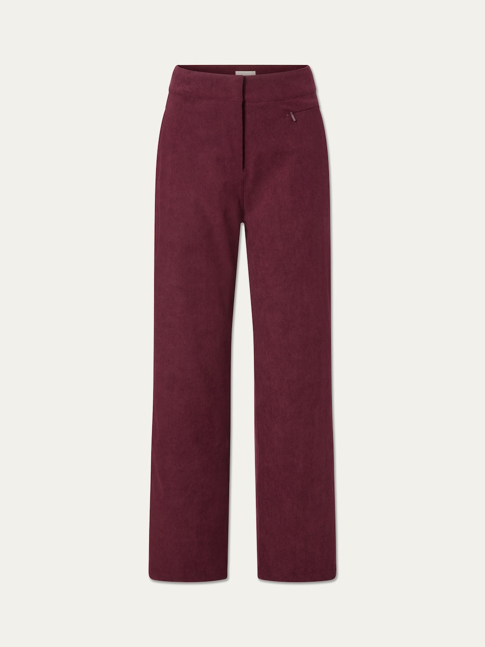The Britt Palazzo Ski Pant Women by We Norwegians is crafted from baby corduroy in a rich burgundy hue. These high-waisted, straight-leg ski pants feature a subtle front seam and a small zipper pocket near the waistband for added functionality. Displayed on a plain white background, they offer an elevated, winter-ready style.