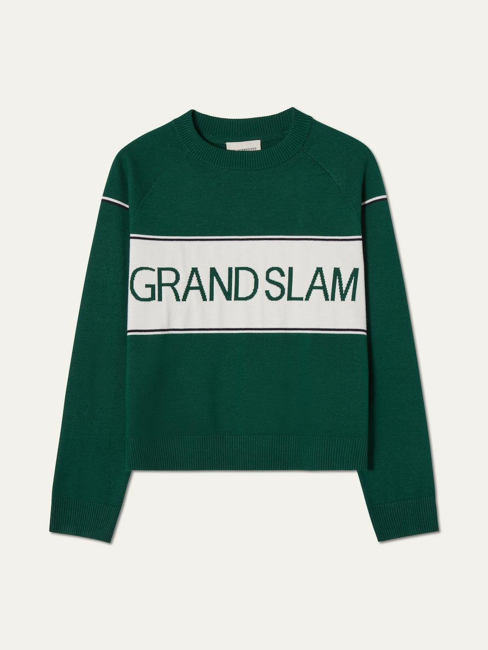 The We Norwegians Grand Slam Sweater Women features green knit with white stripes and bold "GRAND SLAM" across the chest, offering vintage athletic style—ideal for après sport wear.
