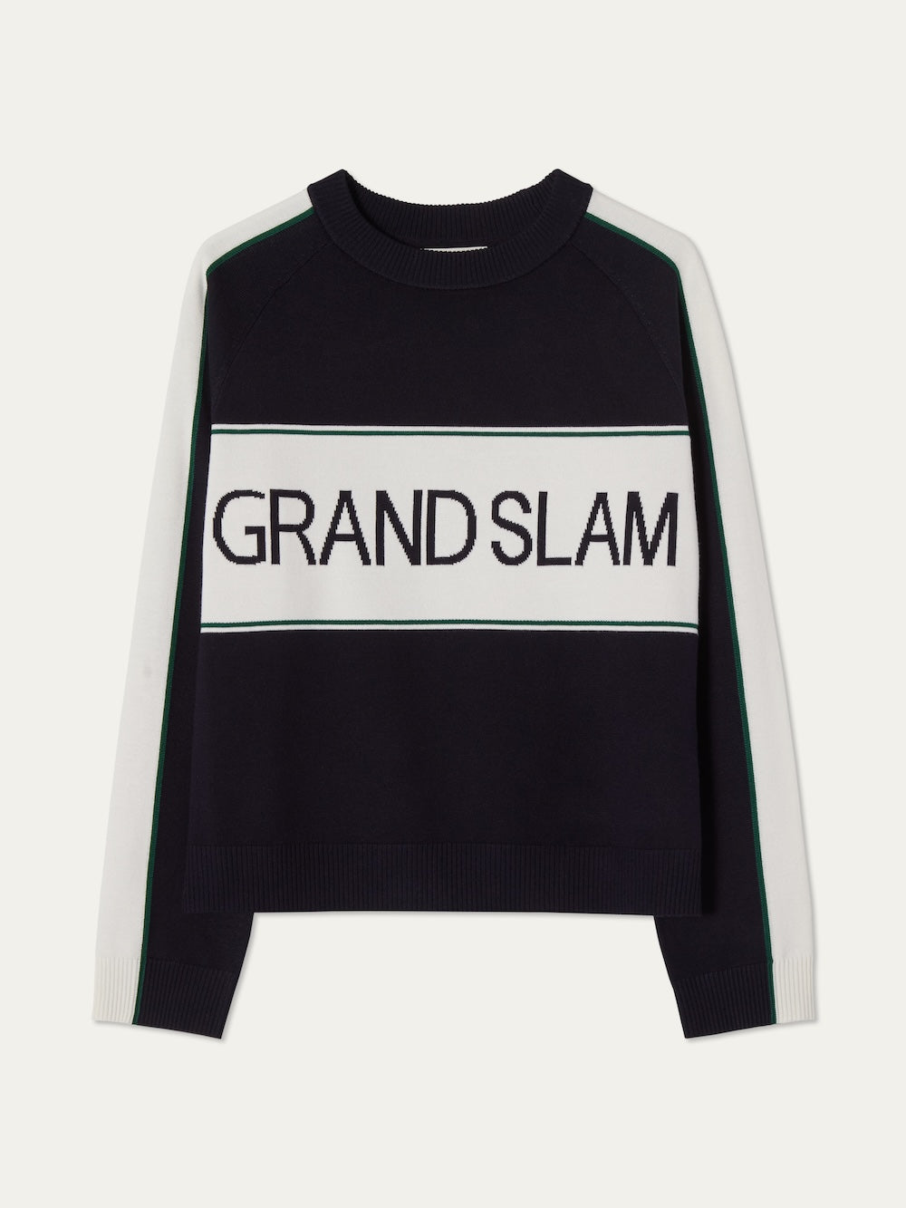 The Grand Slam Sweater Women by We Norwegians is a vintage athletic style with black body, white sleeves, green stripes, and "GRAND SLAM" across the chest—ideal as an après sport layer.