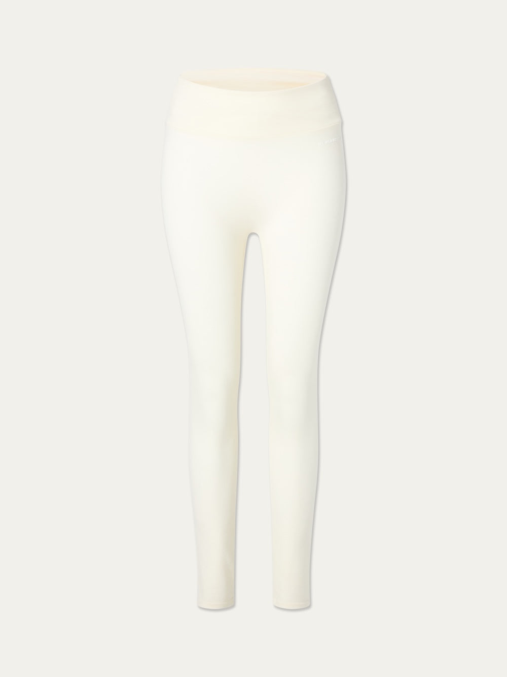 We Norwegians Voss Solid Leggings in high-waisted cream textured piqué fabric.