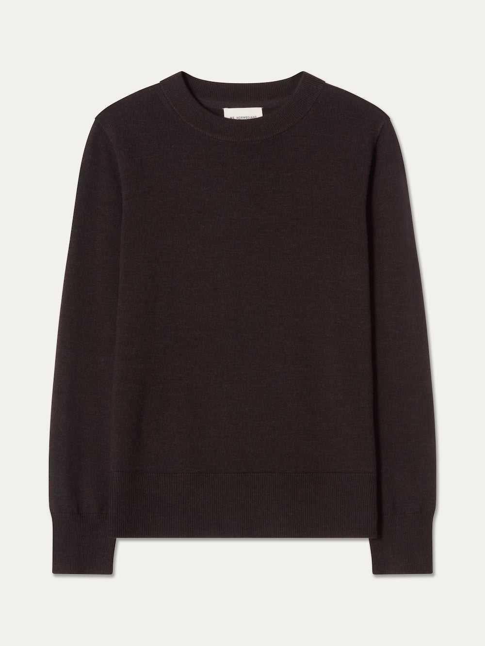 The We Norwegians Geilo Crewneck Women, a classic black merino wool sweater with long sleeves, is laid flat on a light background.