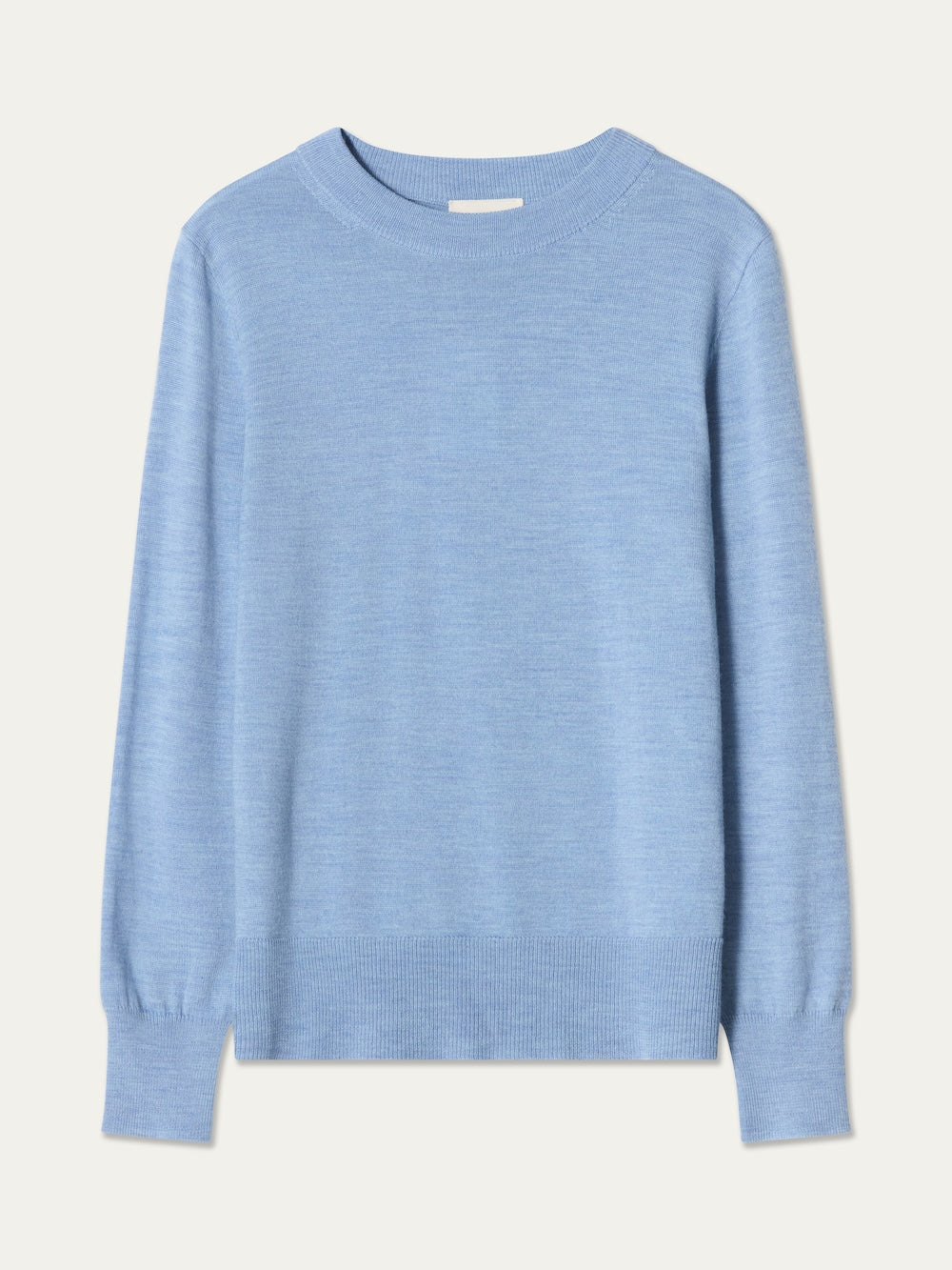 The We Norwegians Geilo Crewneck Women sweater, shown in light blue and laid flat on a plain white background, is crafted from soft merino wool. This long-sleeve crewneck features ribbed cuffs, neckline, and hem, and is made of fine-knit fabric.