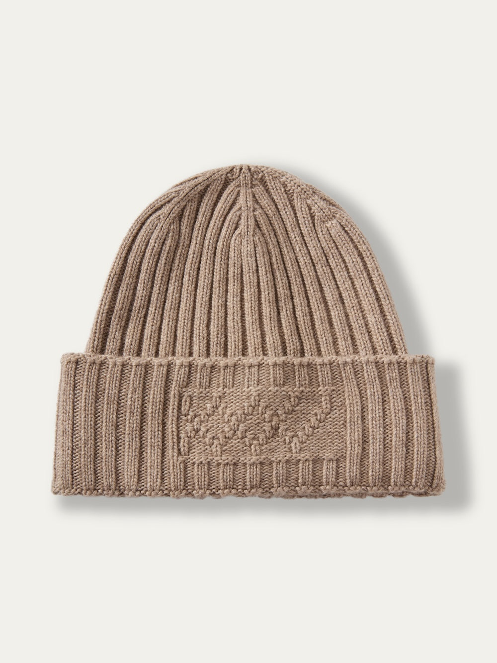Light brown, ribbed knit We Norwegians Geilo Hat with a folded brim and a textured rectangular design on the front.