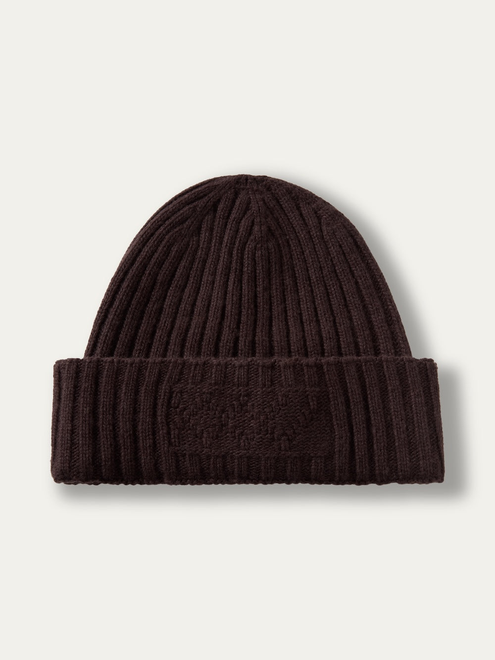 Dark brown We Norwegians Geilo Hat in a ribbed knit with a folded cuff.