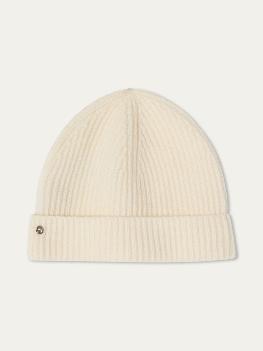 The Blefjell Hat For All by We Norwegians is a cream ribbed knit pure cashmere hat in one size, featuring a folded brim and small round metal logo, shown against a plain white background—a timeless accessory.