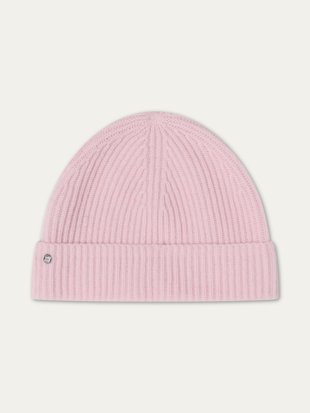 The Blefjell Hat For All by We Norwegians is a light pink pure cashmere knit beanie featuring a folded brim and small metal tag on the left side. One size fits most, shown on a plain white background.