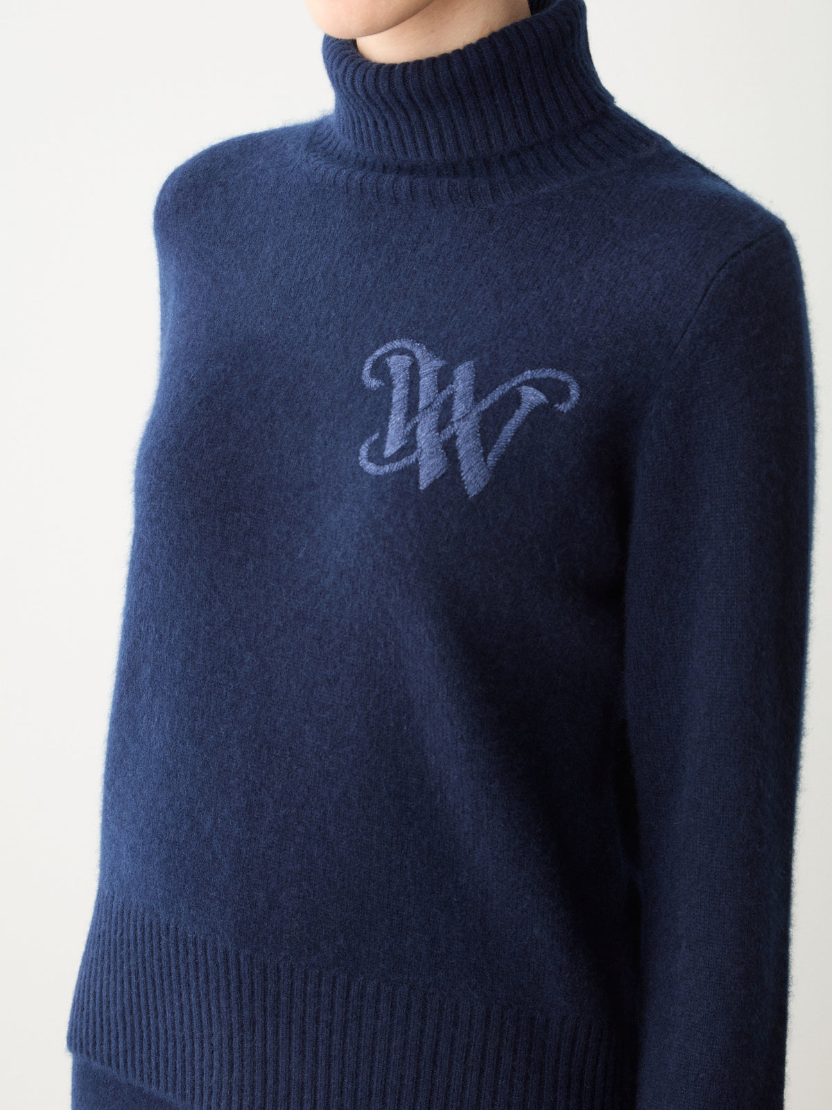 Navy blue We Norwegians Monogram Cashmere Sweater Women featuring a tonal monogram logo on the chest.