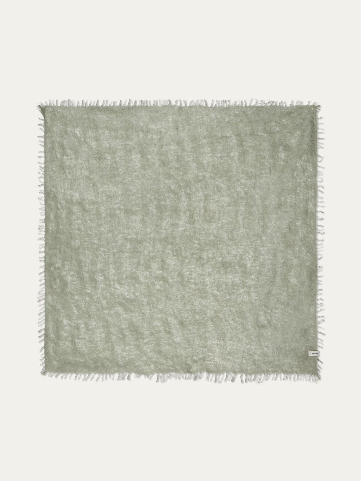 Featherlight sage green square Monogram Cashmere Scarf by We Norwegians with frayed edges.