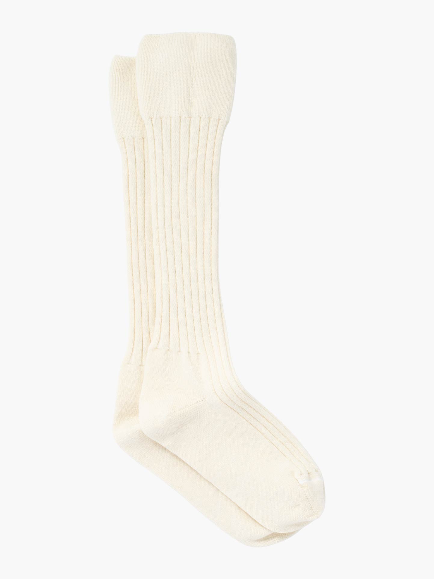 The Telemark Socks by We Norwegians are off-white, ribbed knee-highs made from a soft wool blend, stylishly showcased on a simple white background.