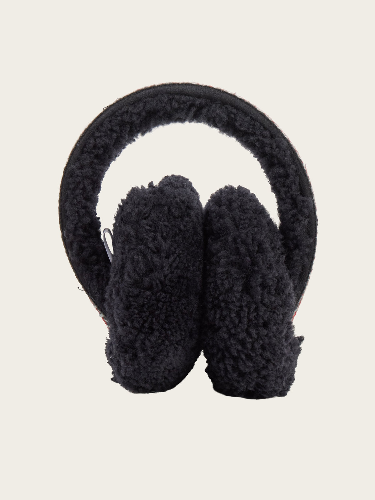 The EMU x WN Angahook Teddy Earmuff by We Norwegians features a black, fluffy teddy finish with a soft, rounded headband, and is displayed upright against a plain light background.