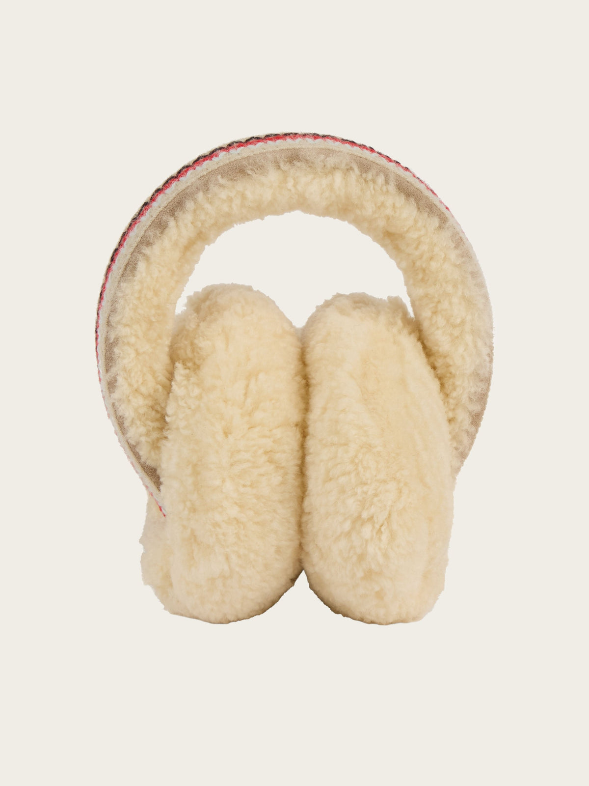 The We Norwegians EMU x WN Angahook Teddy Earmuff features cream-colored, plush ear covers and a textured band in a cozy teddy finish, displayed against a plain, light background.